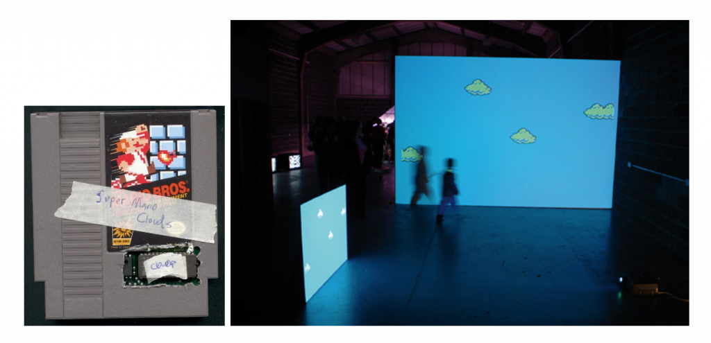 Fig. 2. Hacked Nintendo Entertainment System cartridge that is part of Cory Arcangel’s work “Super Mario Clouds. Fig. 2. 2 The piece as it was exhibited in Team Gallery, New York, showing two big screens with sky and clouds of Super Mario Bros game and the silhouette of a spectator crossing in front of one of the screens.