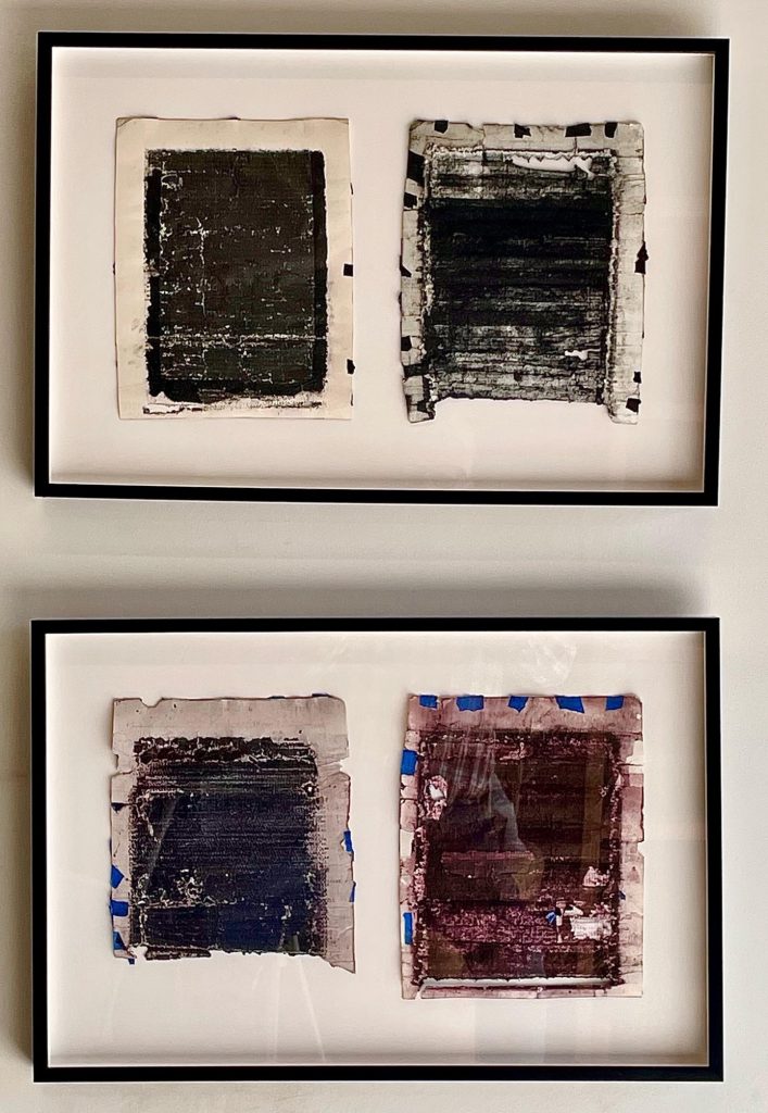 Two framed prints, each frame has two destroyed pages.